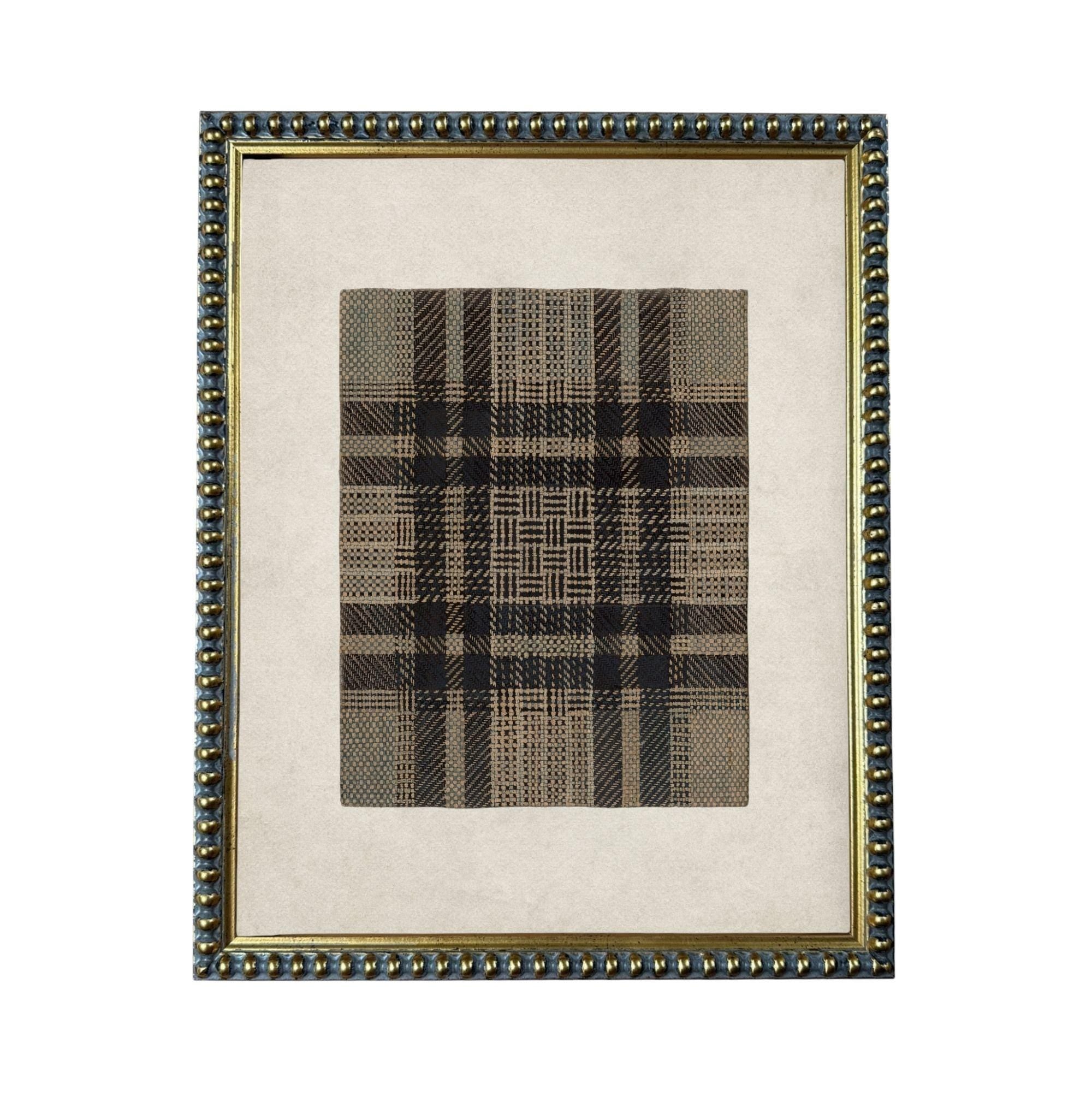 a square frame with a decorative border, containing a black and white checkered pattern.