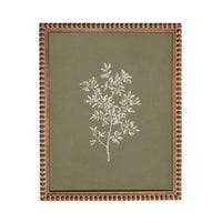 a framed artwork depicting a tree with white leaves against a green background.