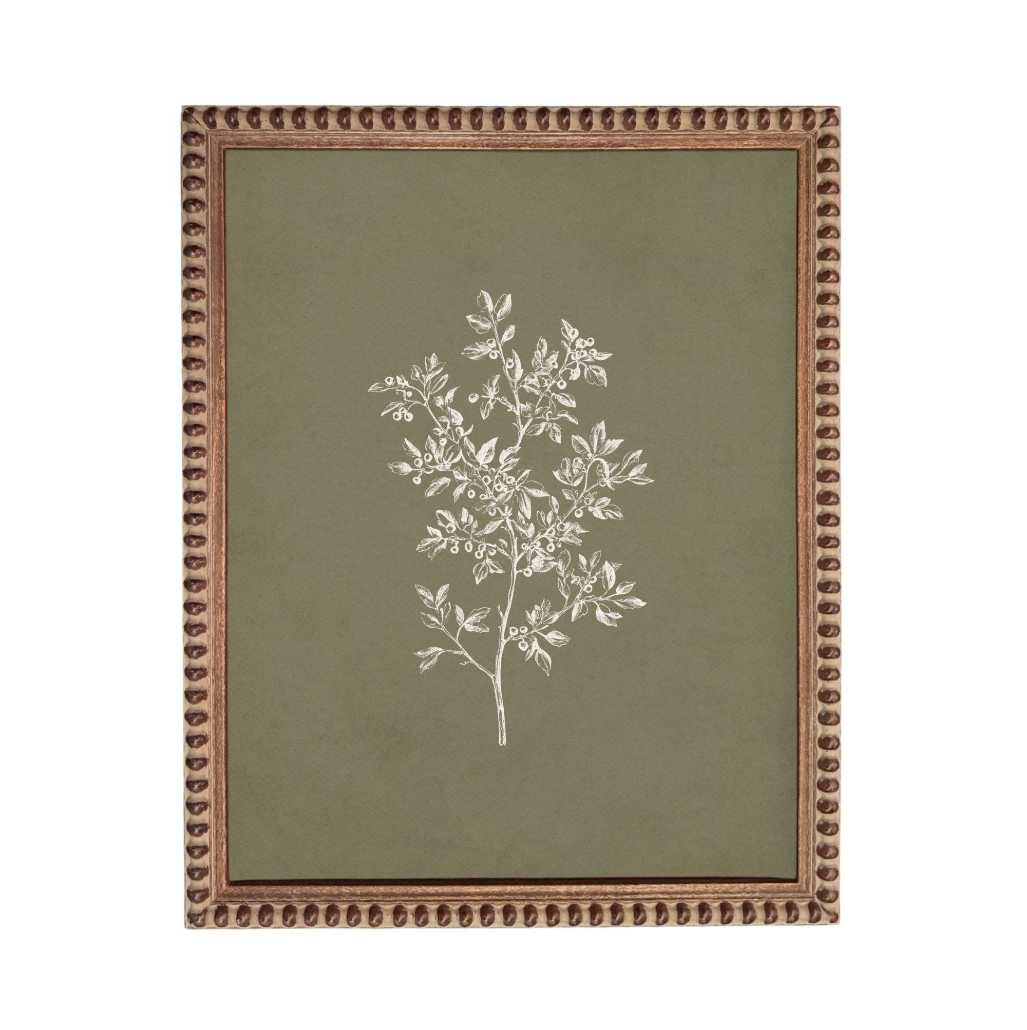 a framed artwork depicting a tree with white leaves against a green background.