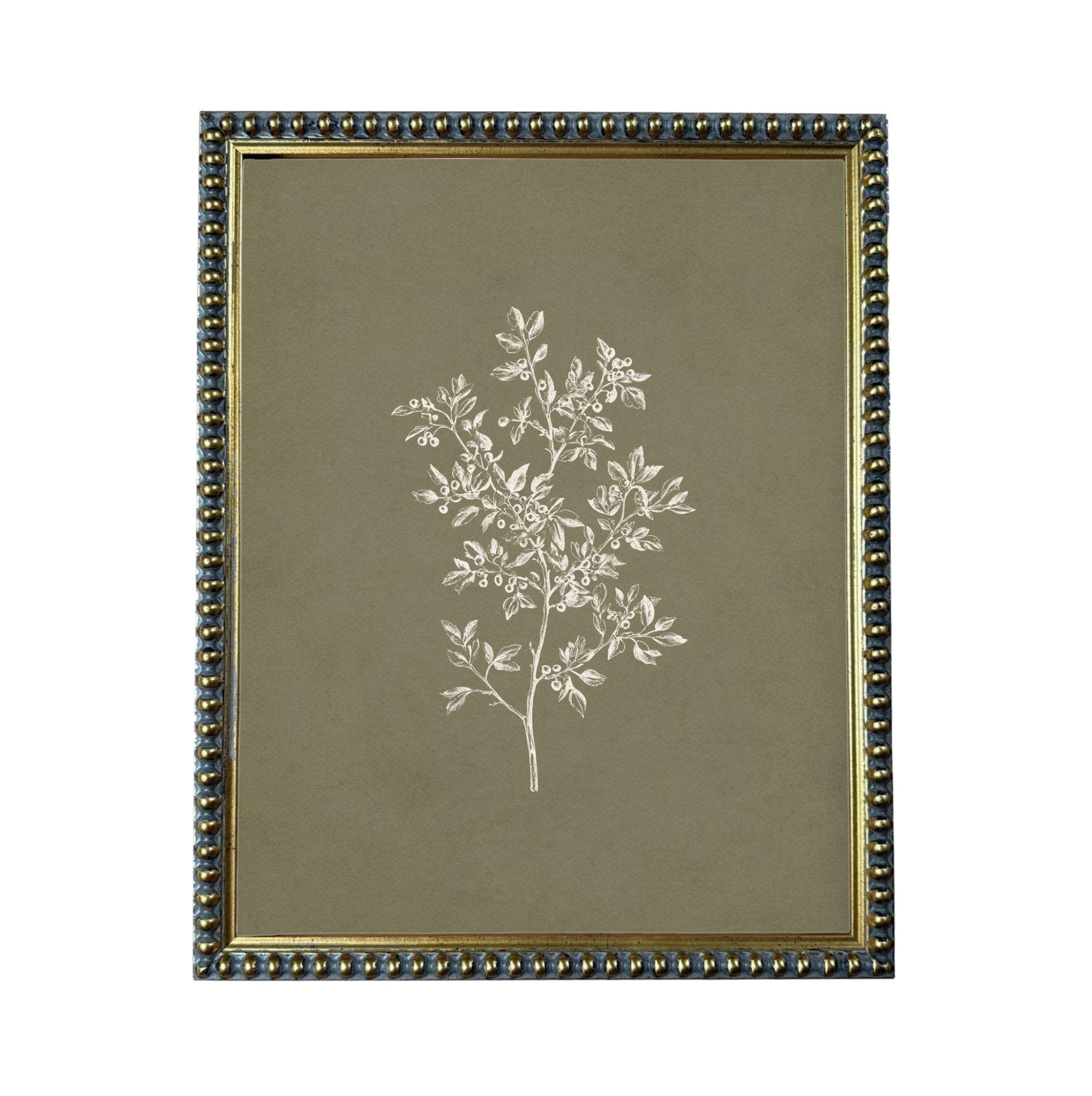 a framed print of a tree with white leaves against a dark green background.