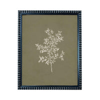 a framed print of a tree with white leaves against a dark green background.