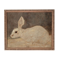 A painting of a white rabbit sitting on a surface.