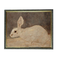 A painting of a white rabbit sitting on a surface.