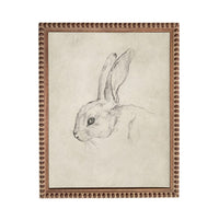 A framed drawing of a rabbit's head in black and white.