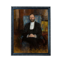 A portrait of a man wearing a suit and tie, sitting in a chair and looking directly at the viewer.