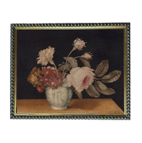 A framed painting depicting a vase filled with various flowers, including roses and carnations, set against a dark background.