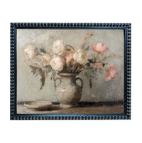 A framed painting depicting a vase filled with pink and white flowers, placed on a table.