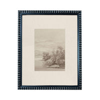The image is a framed artwork depicting a serene landscape with trees, water, and mountains in the background.