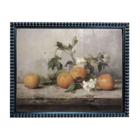 A framed painting depicting a still life arrangement of oranges and flowers on a wooden surface.