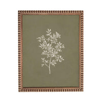 a framed artwork depicting a tree with white leaves against a green background.