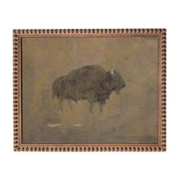 a large, dark-colored animal, possibly a bison or a buffalo, standing in a field or natural environment.