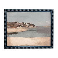 The image is a framed painting depicting a coastal town with buildings and a beach in the background.