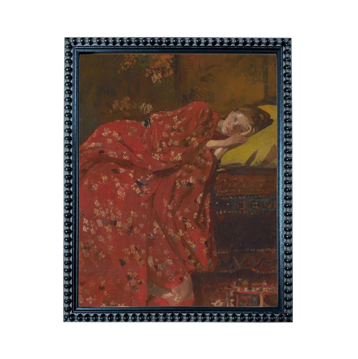 The image is a framed painting depicting a woman in a red floral dress lying down on a bed.