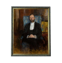 A portrait of a man wearing a suit and tie, sitting in a chair and looking directly at the viewer.
