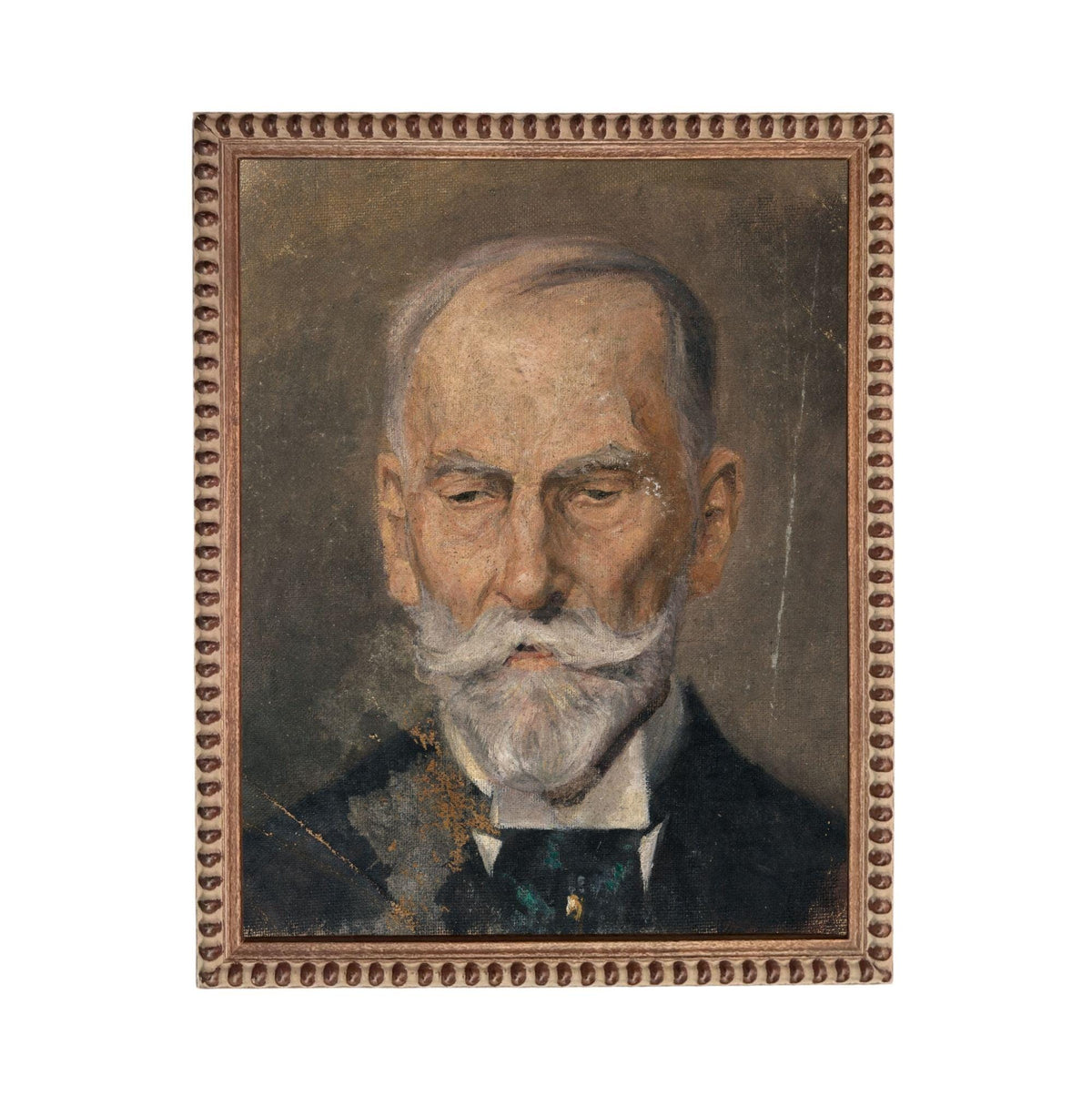 The image is a portrait of an elderly man with a white beard and mustache, wearing a suit and tie.