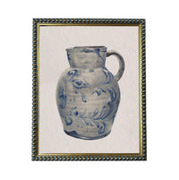 A framed image of a blue and white ceramic pitcher with a floral pattern.