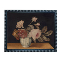 A framed painting depicting a vase filled with various flowers, including roses and carnations, set against a dark background.