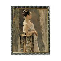 A woman in a white dress is seated on a wooden chair, her gaze directed off to the side.